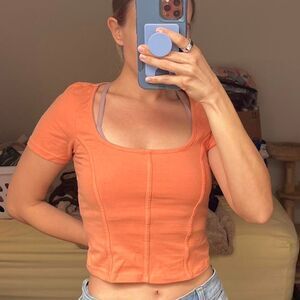 Orange crop top with square neckline Size small.